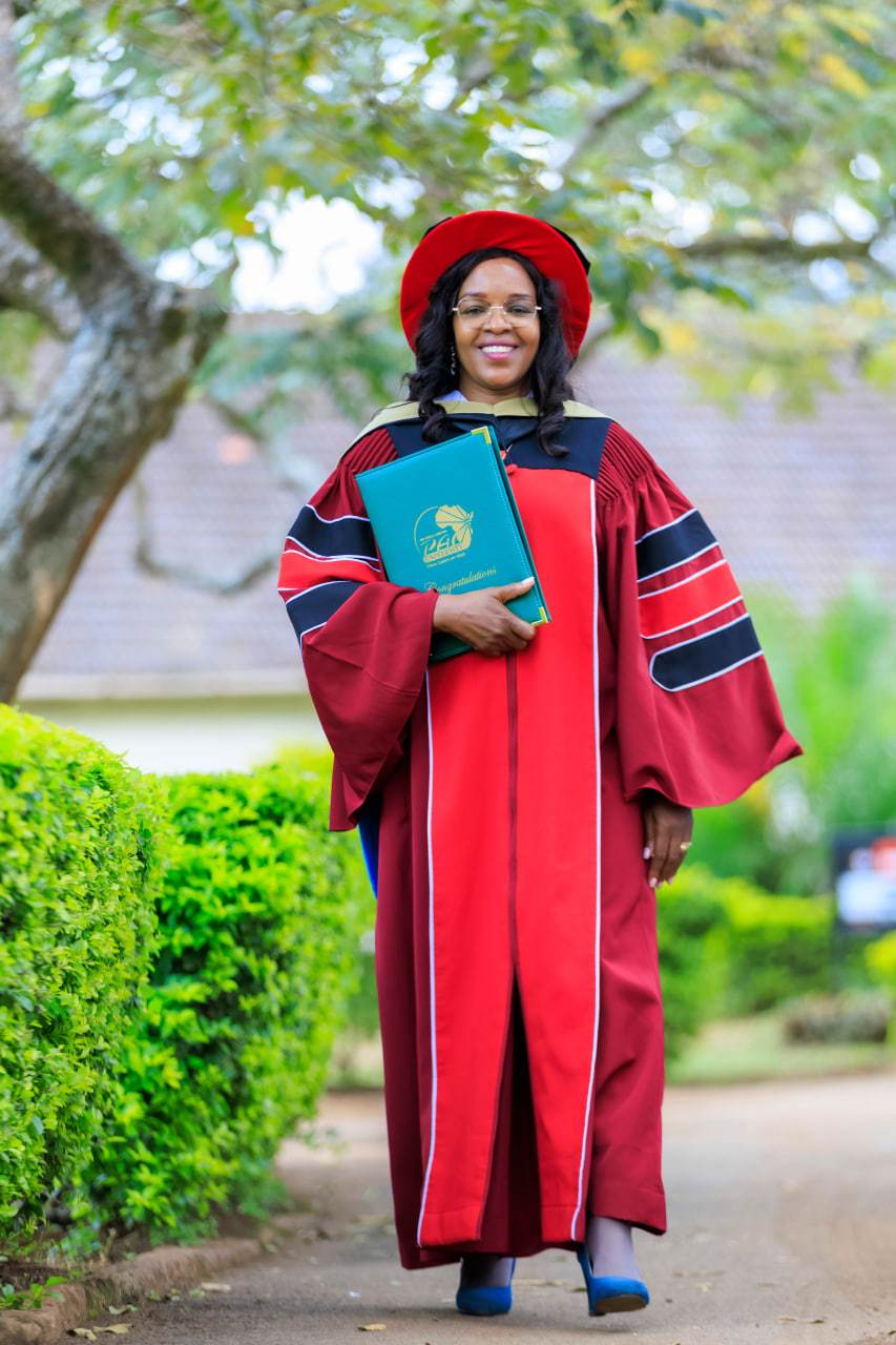 Desk with leather desk pad, walnut desk organizer, wireless keyboard and mouse, and porcelain mug.
